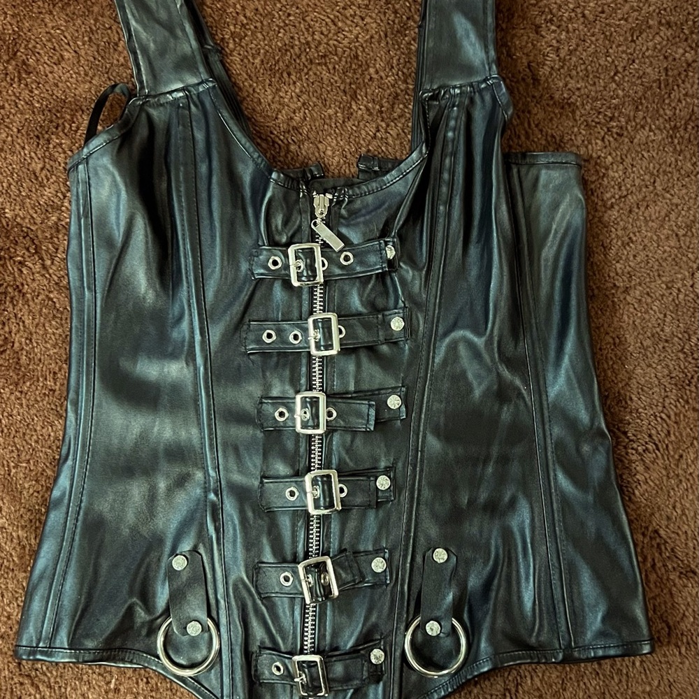 Pleather Biker top, zipper and buckle front,  lace up back.  Sexy